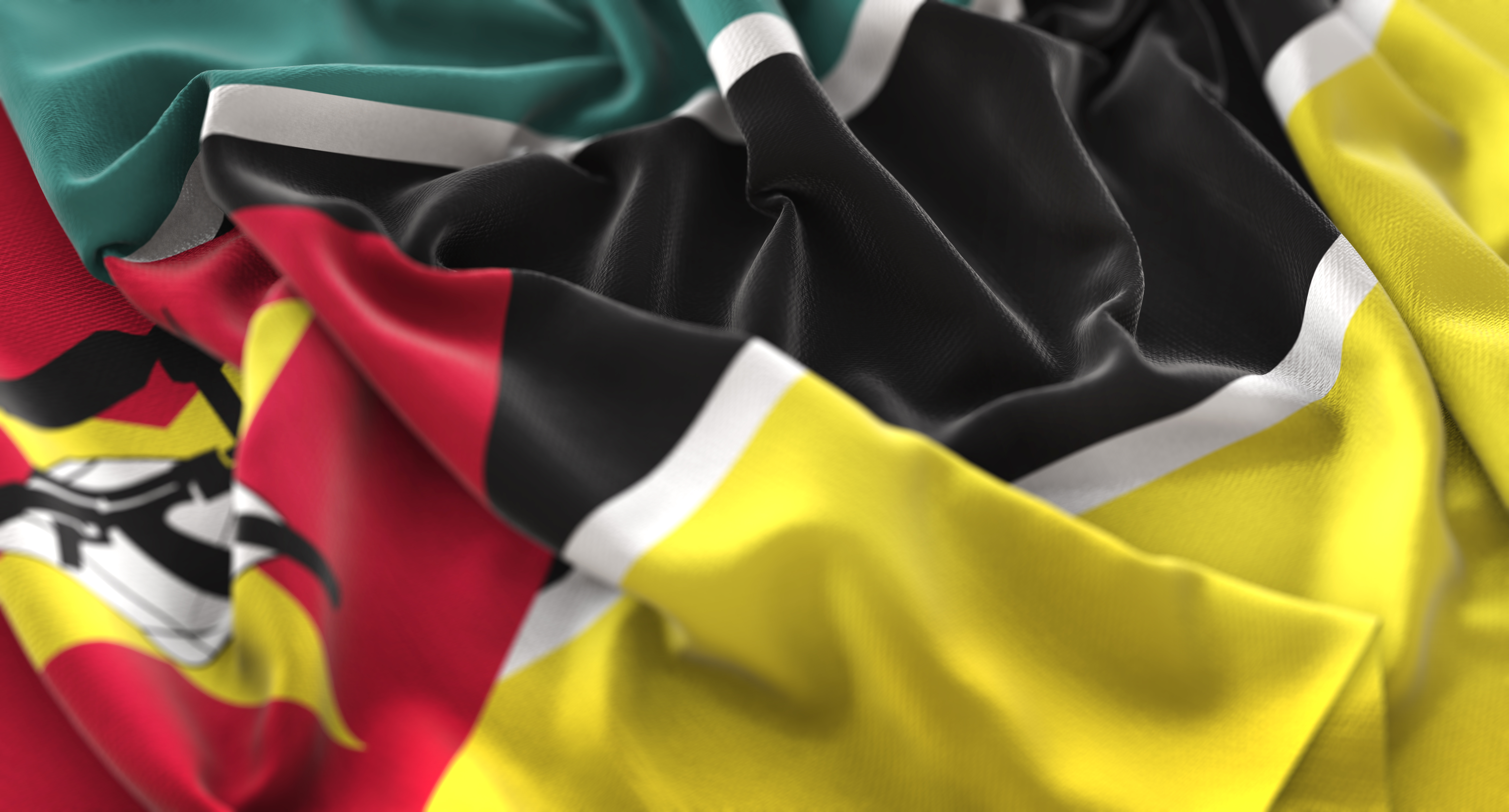 Mozambique Flag Ruffled Beautifully Waving Macro Close-Up Shot
